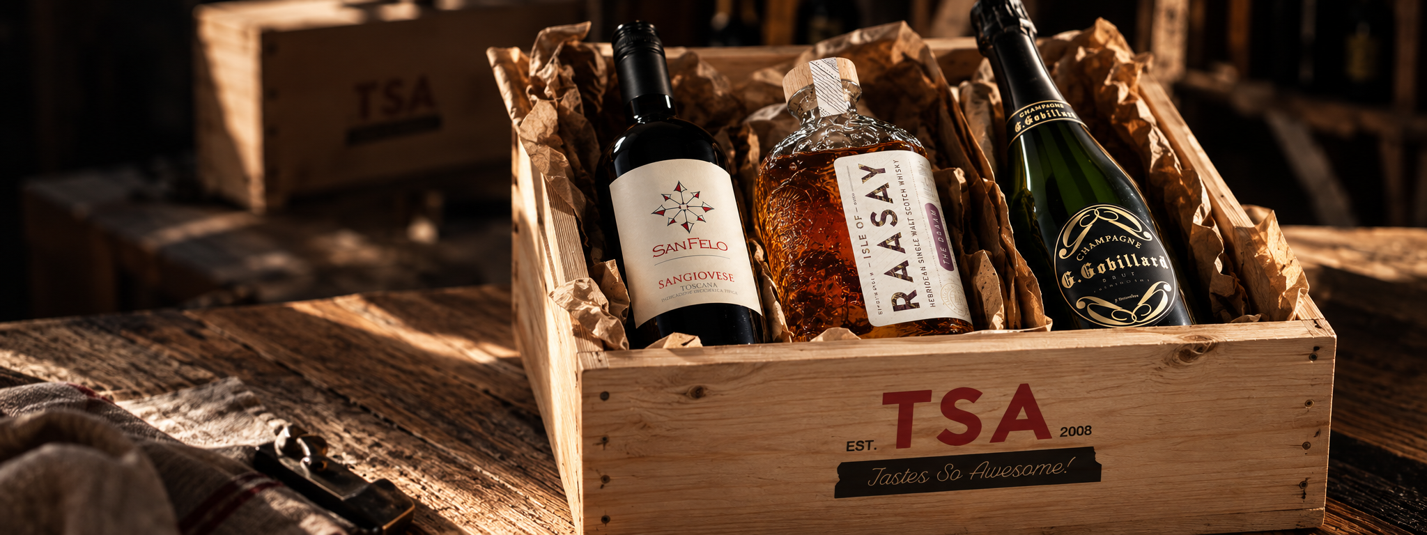 A wooden TSA Wines crate packed with sangiovese, Isle of Raasay whisky and G. Gobillard champagne